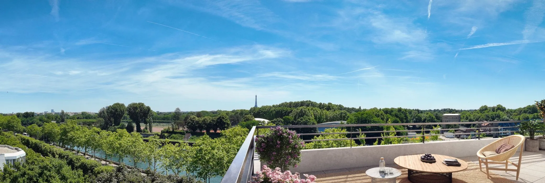 Vue depuis le rooftop d'un immeuble moderne, on peut apercevoir la Tour Eiffel au loin